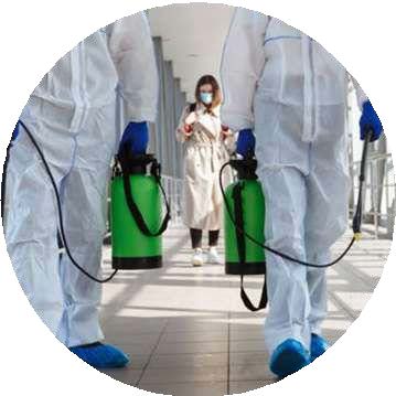 Person in protective gear performing fumigation